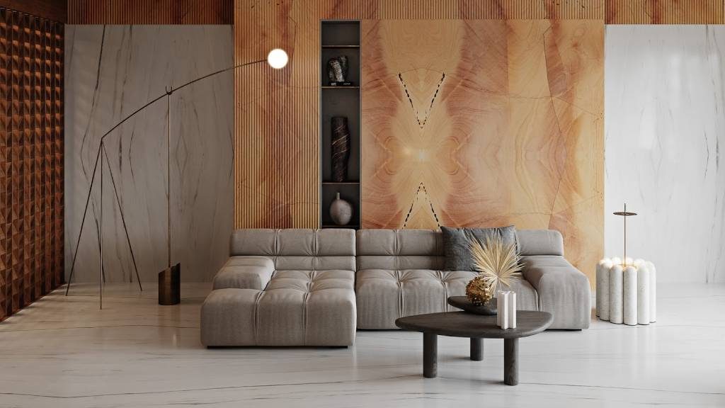 Luxury living room with a bookmatched marble feature wall in warm golden tones, paired with modern furniture and natural stone flooring.