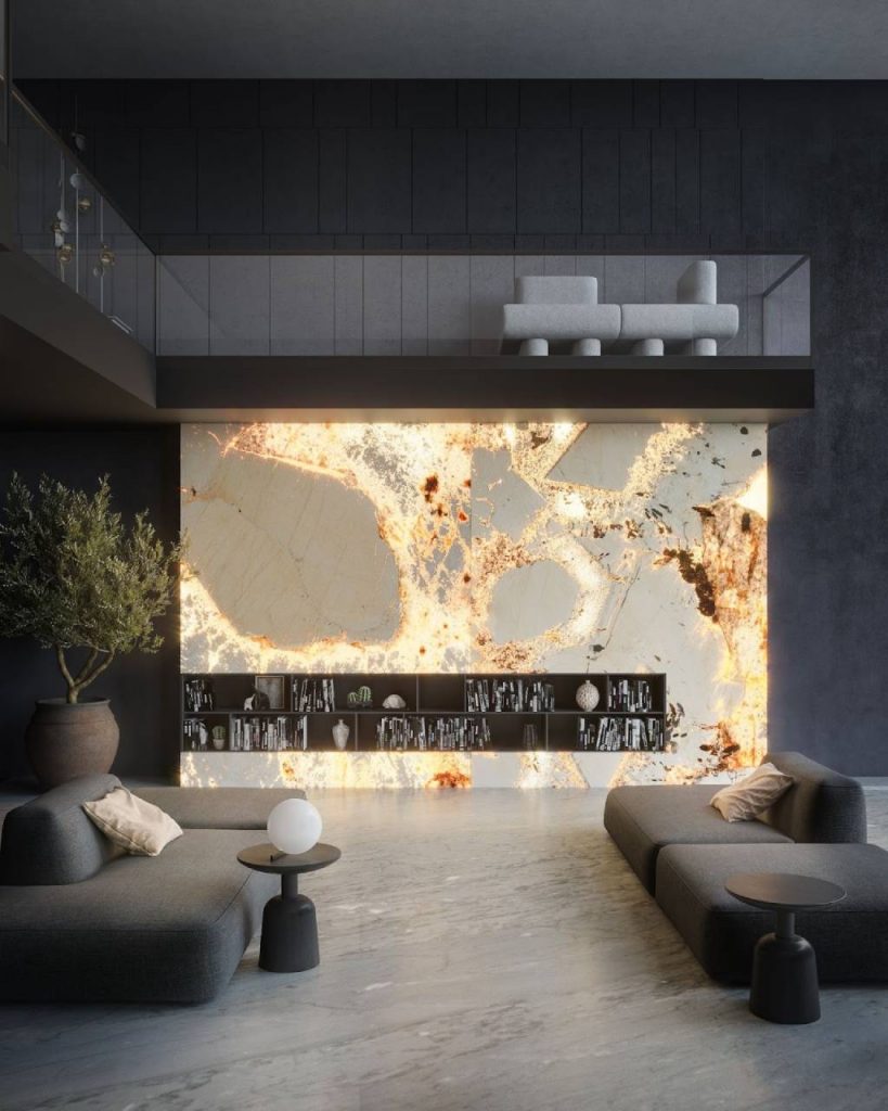Statement marble feature wall with glowing golden veining and natural stone textures illuminating a modern double-height living room.