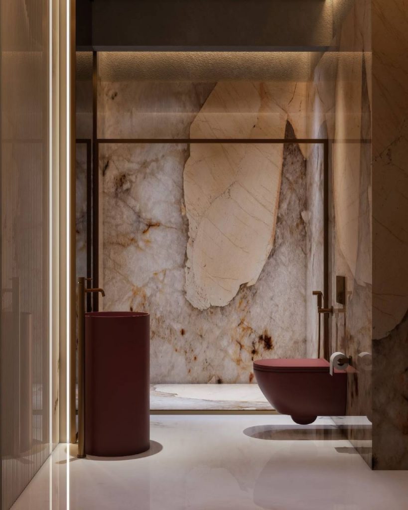  Luxury marble bathroom wall design with large natural stone slabs, warm veining patterns and modern minimal fixtures.
